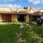 LOTE 006 - OSÓRIO. Terreno com casa no Bairro Albatroz.